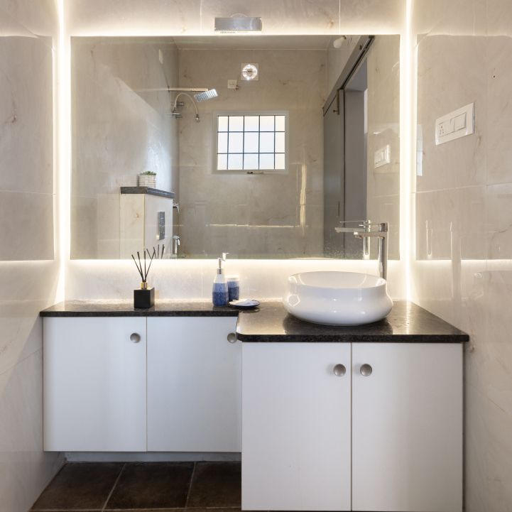 Modern White And Beige Bathroom Design With Rectangular Mirror And LED Lights