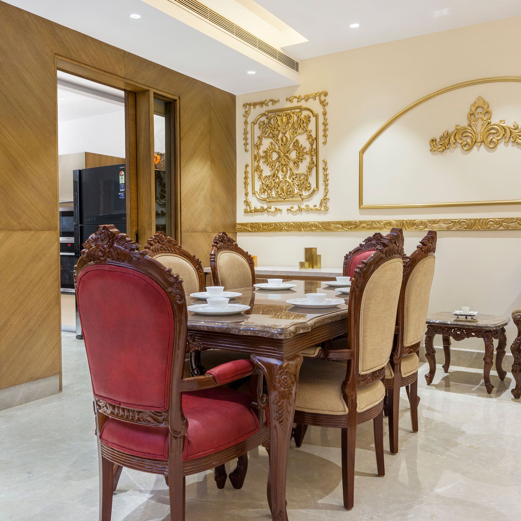 Contemporary 6-Seater Dining Room Design With Golden Wall Trims