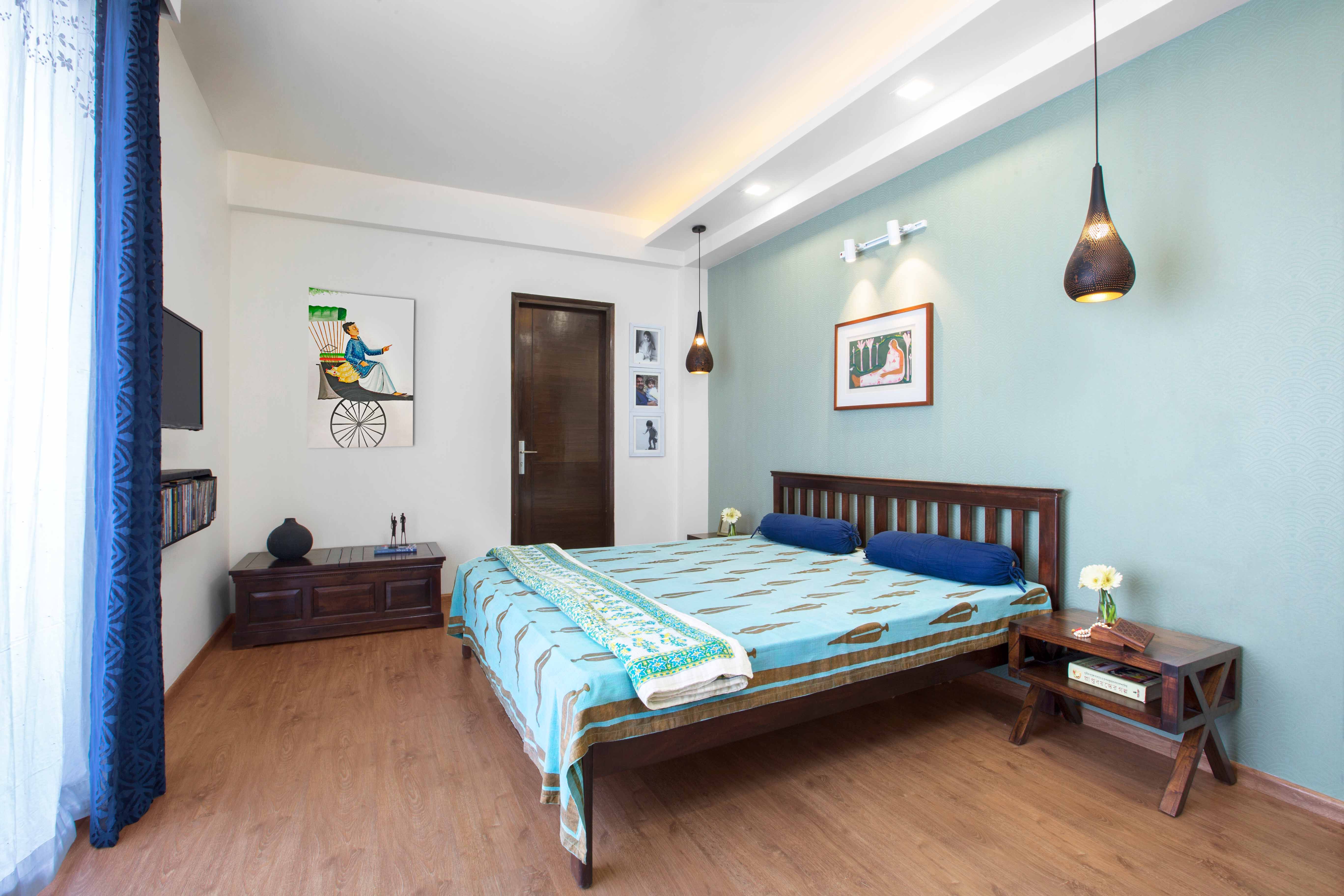 Classic Guest Room Design With Wooden Bed And Light Blue Accent Wall