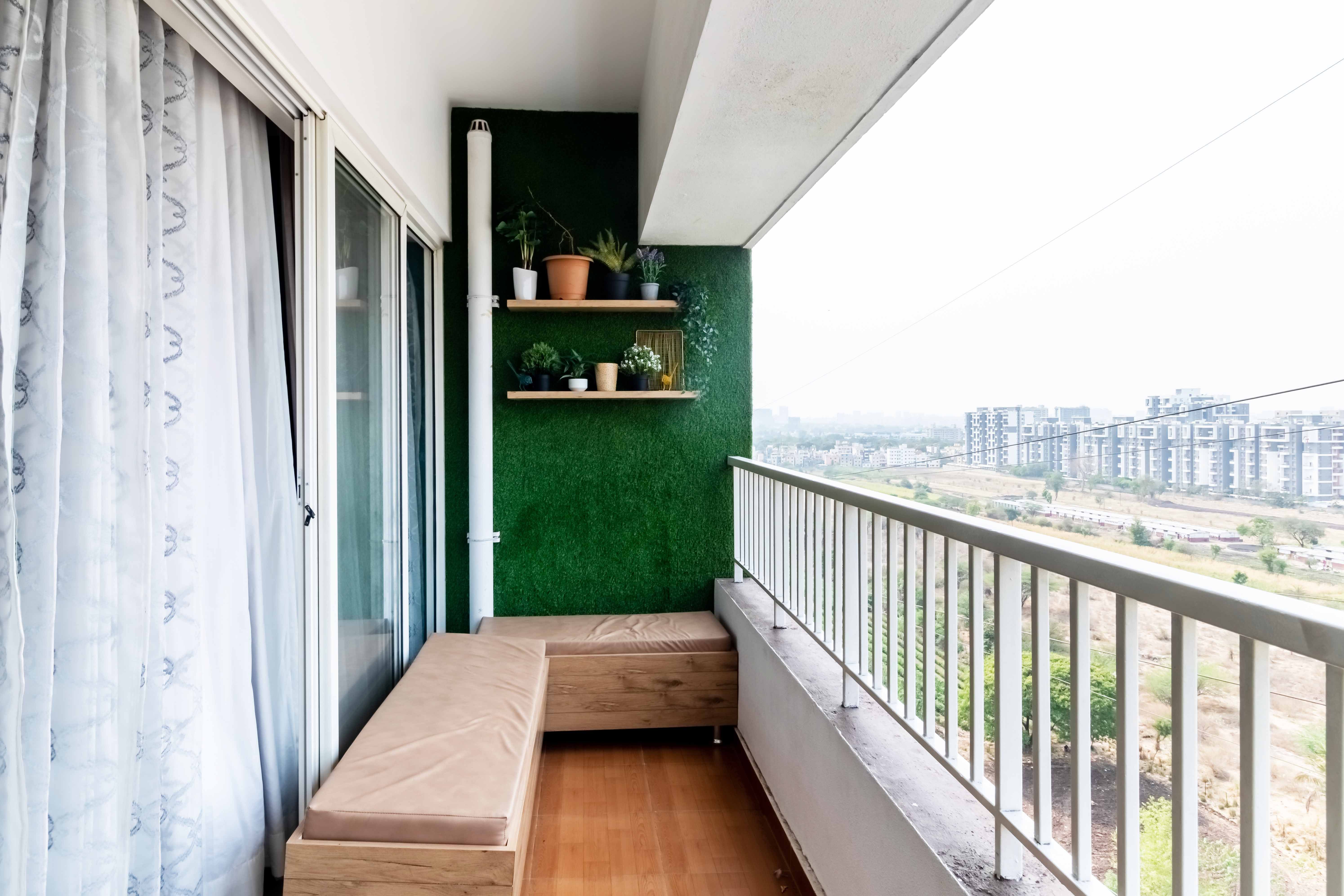 Modern Balcony Design With Grass Wall And L-Shaped Seater