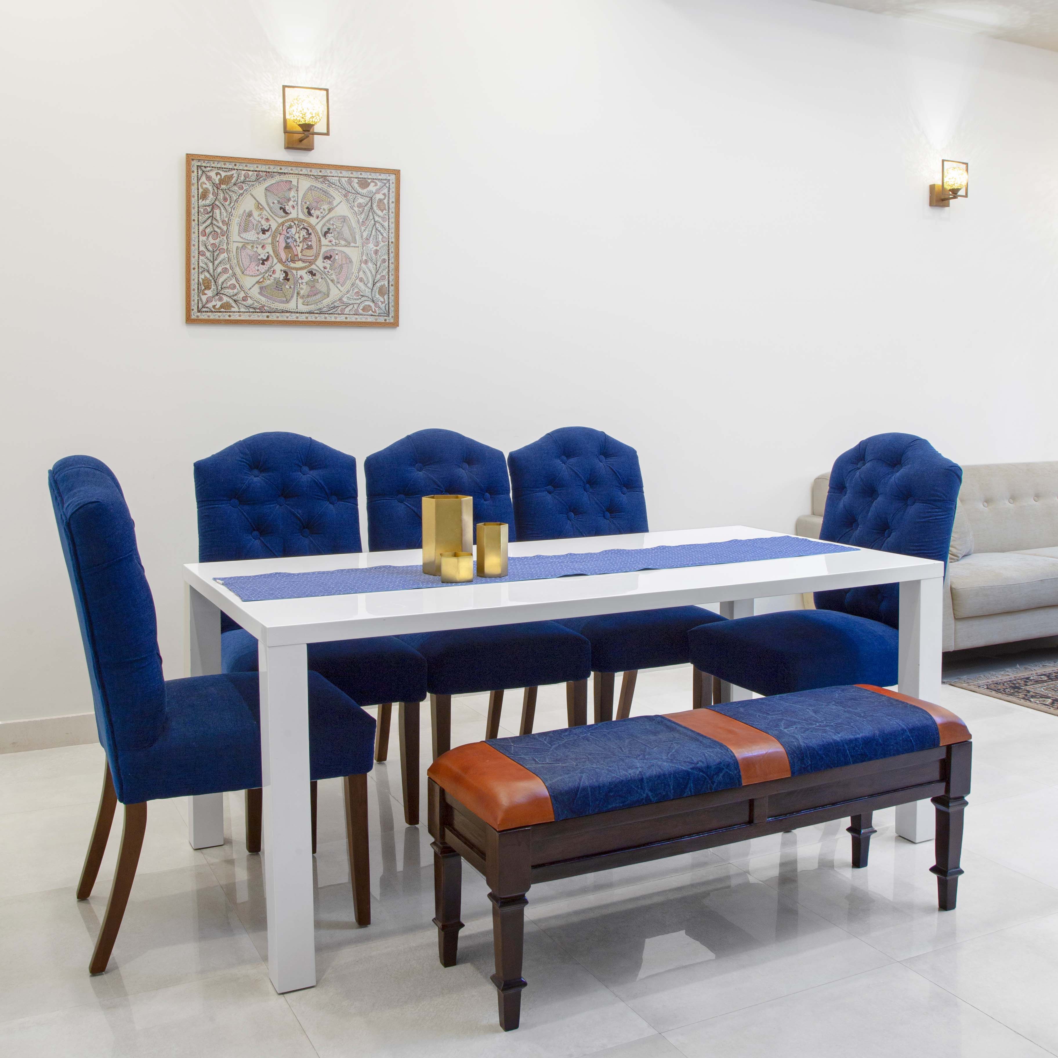 Modern Dining Room Design With Blue Upholstered Bench And Chairs