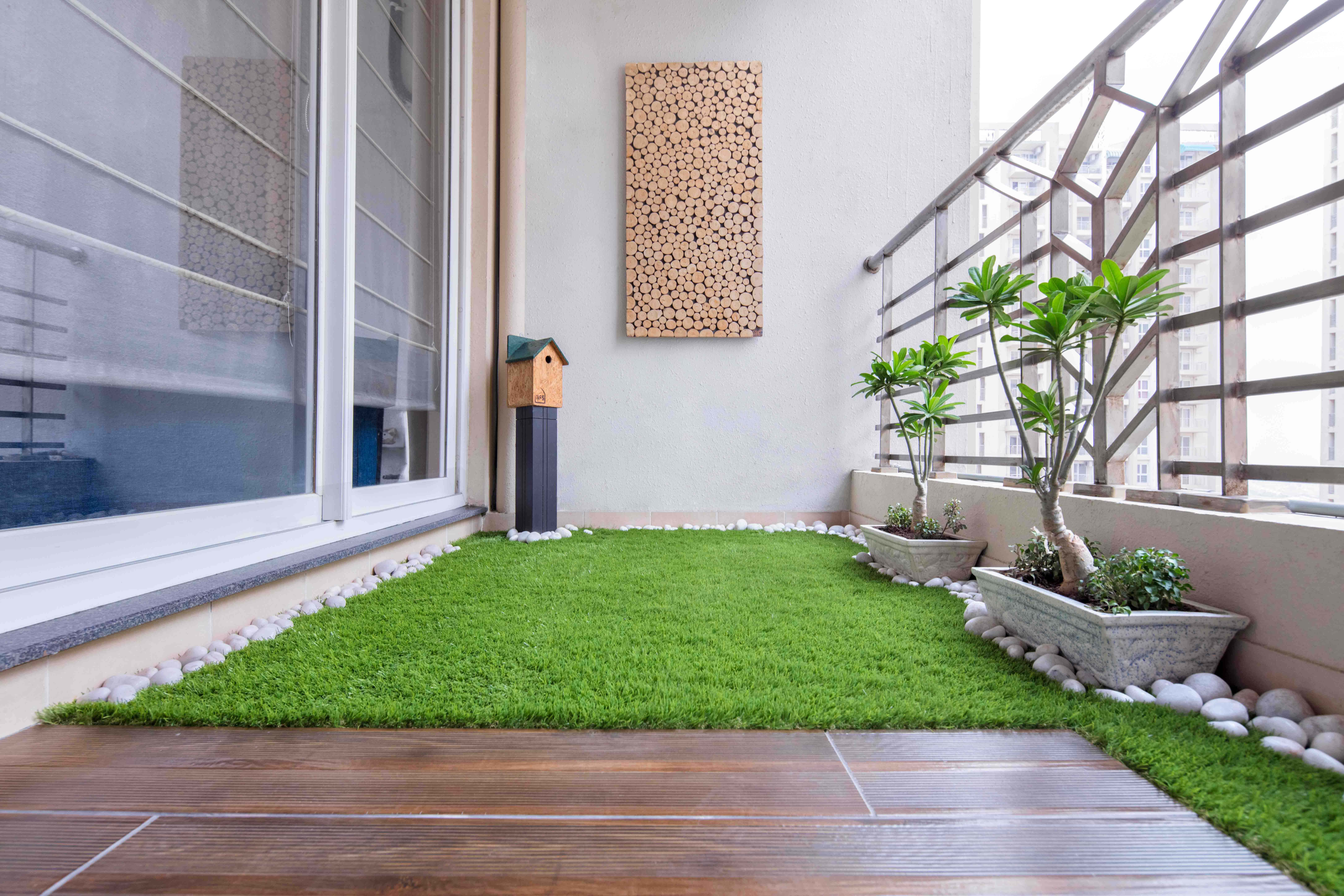 Modern Balcony Design With Turf Grass Flooring And Mural