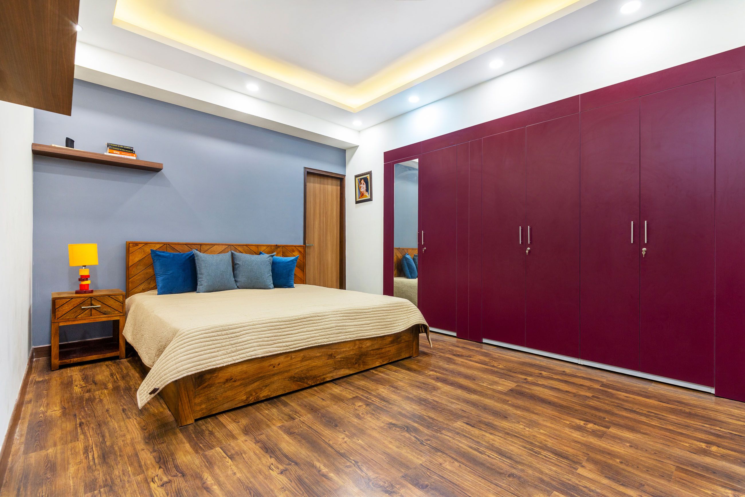 Contemporary 2-BHK Flat In Noida With Colourful Wardrobe Units