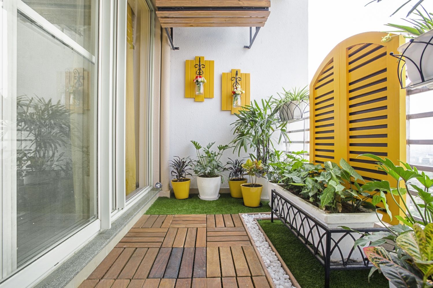 Tropical Balcony Design With Wooden Flooring And Yellow Accents