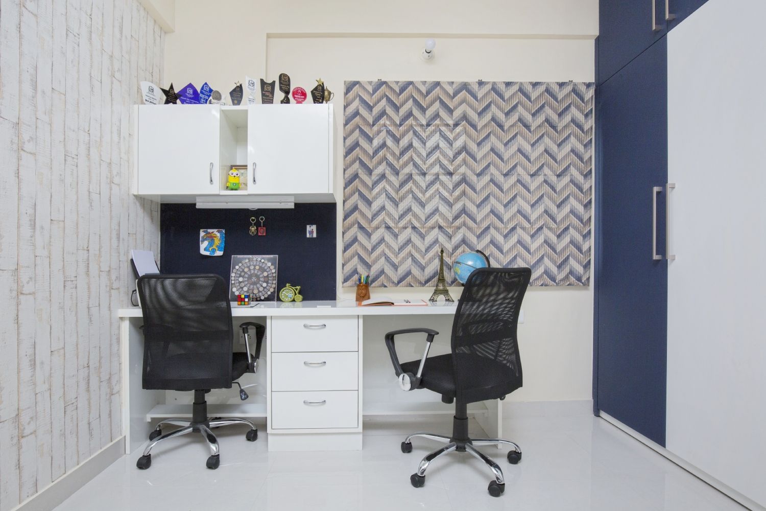 Modern Frosty White Home Office Design With Two Black Swivel Chairs