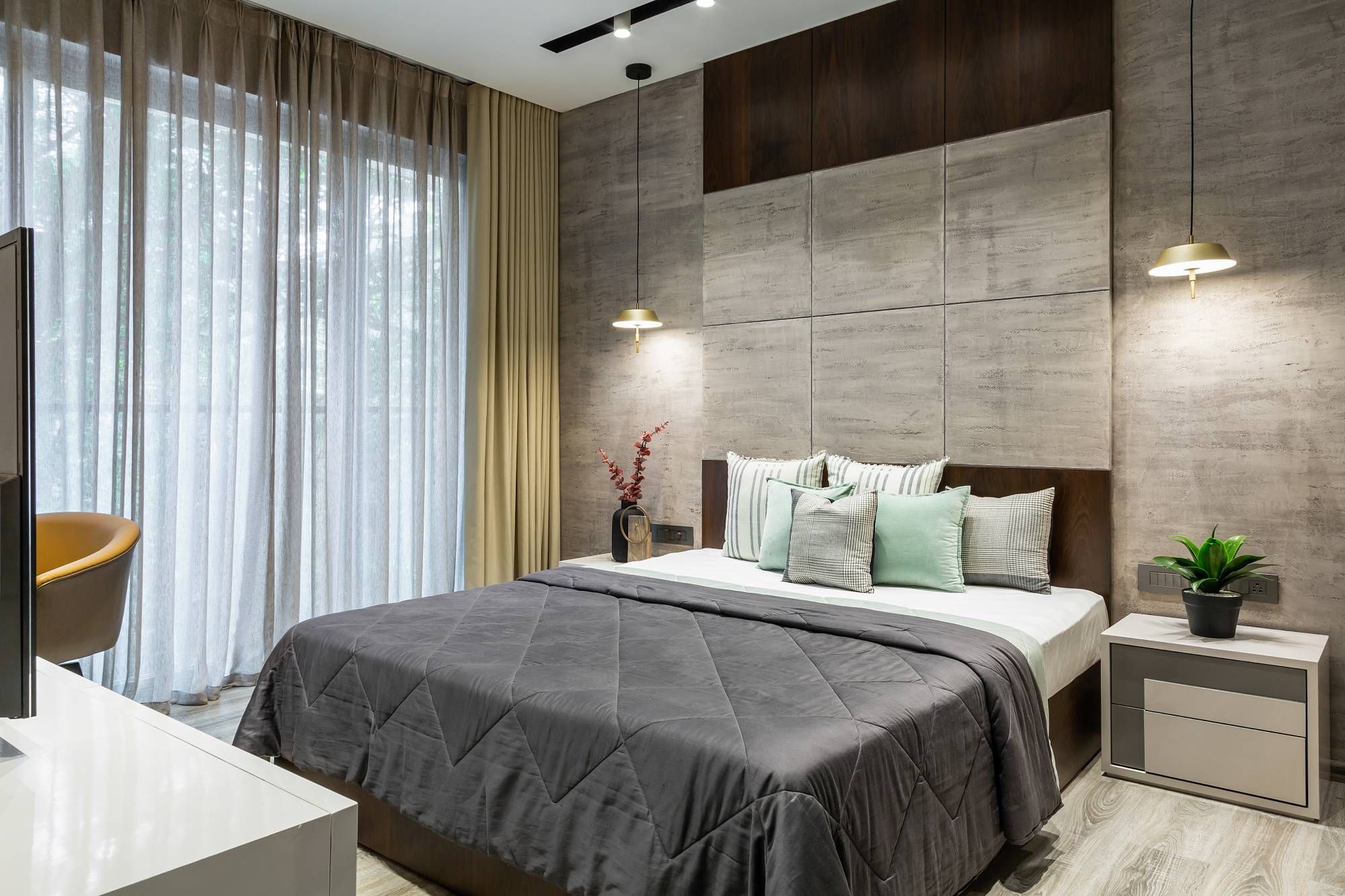 Modern Bedroom Design With A King Size Bed And Textured Wall Panelling